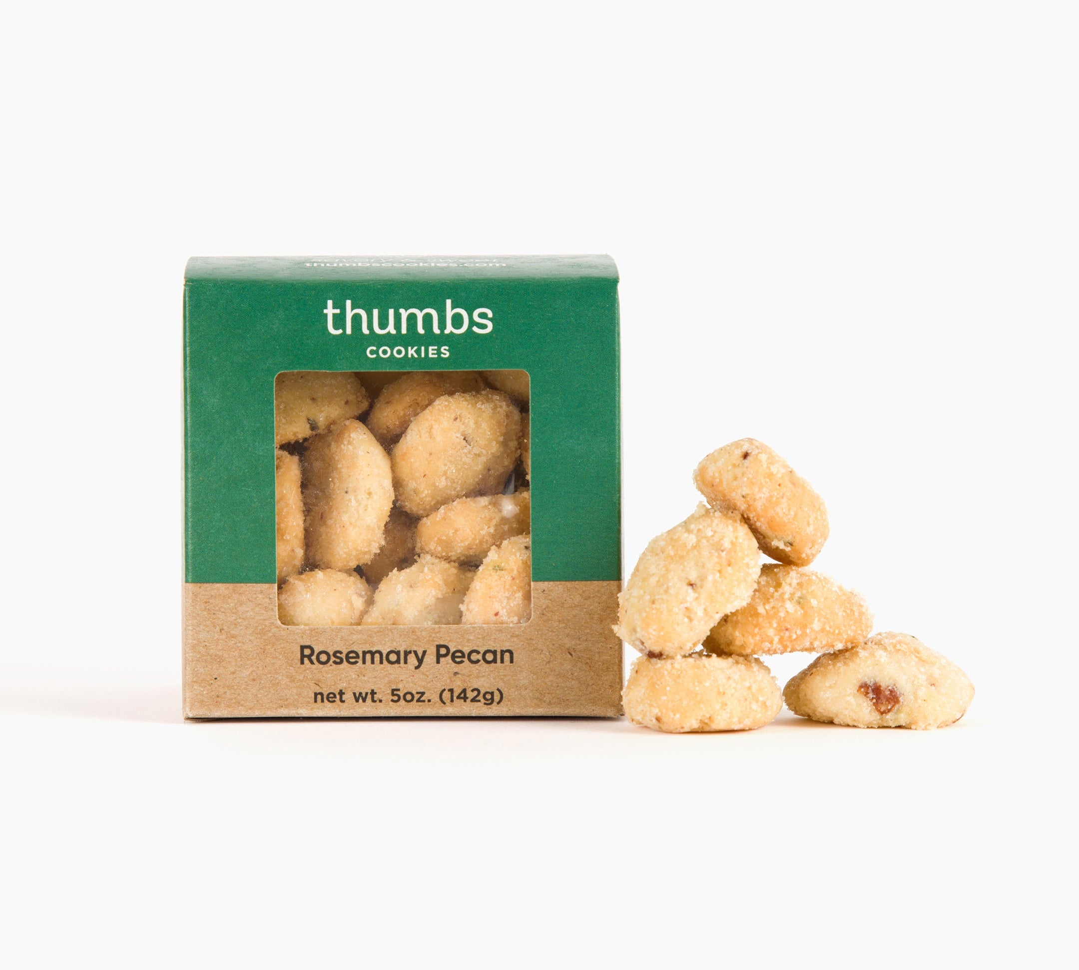 A box labeled "Thumbs Cookies" with rosemary pecan flavor is pictured beside cookies topped with chopped pecans and a hint of rosemary. The net weight is 5 oz (142g).