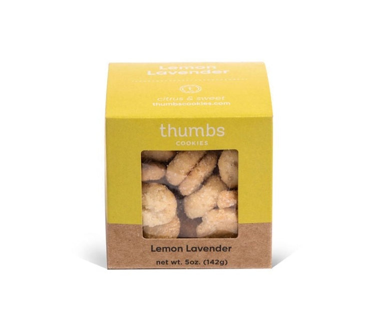 A box labeled "Thumbs Cookies" with lemon lavender flavor showing round tiny cookies that have a light, citrusy color and subtle purple specks. The net weight is 5 oz (142g).