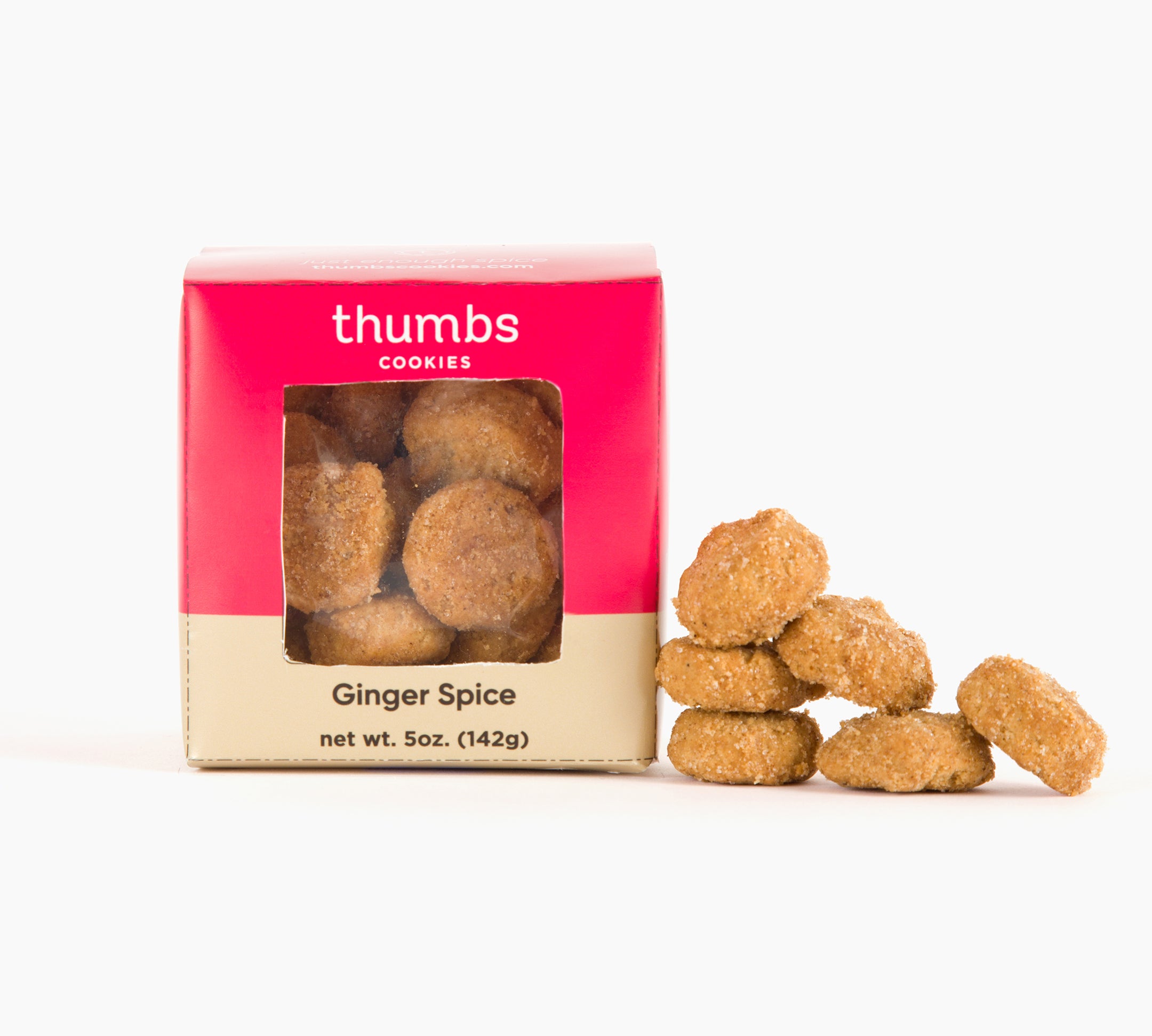A box labeled "Thumbs Cookies" with ginger spice flavor appears next to a few cookies with a warm golden hue, hinting at spiced flavor. The net weight is 5 oz (142g).
