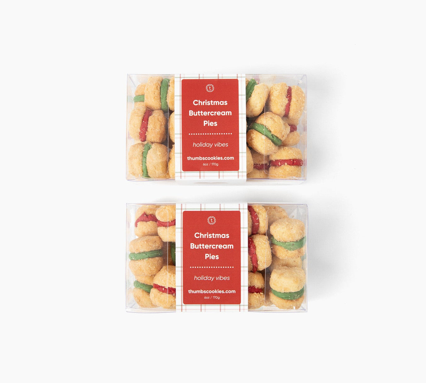 Two packages of Christmas shortbread cookies with red labels on a white background