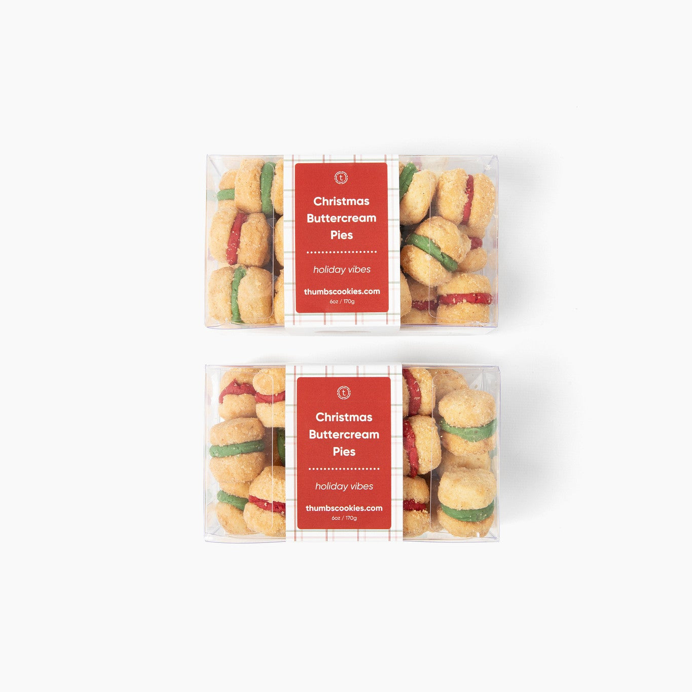 Two packages of Christmas shortbread cookies with red labels on a white background